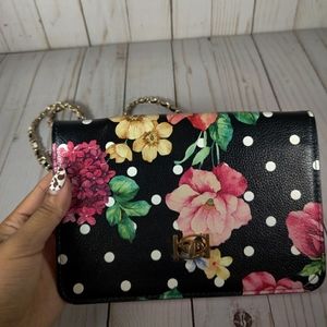Floral polka dot bebe cross body bag with chain.